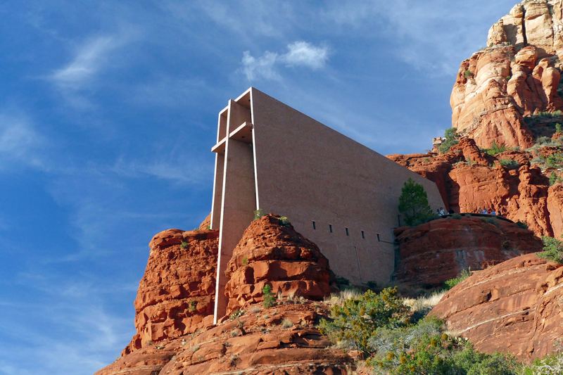 Chapel of the Holy Cross, a concrete chapel with a tall cross in its front wall, built into red rock buttes south of Sedona